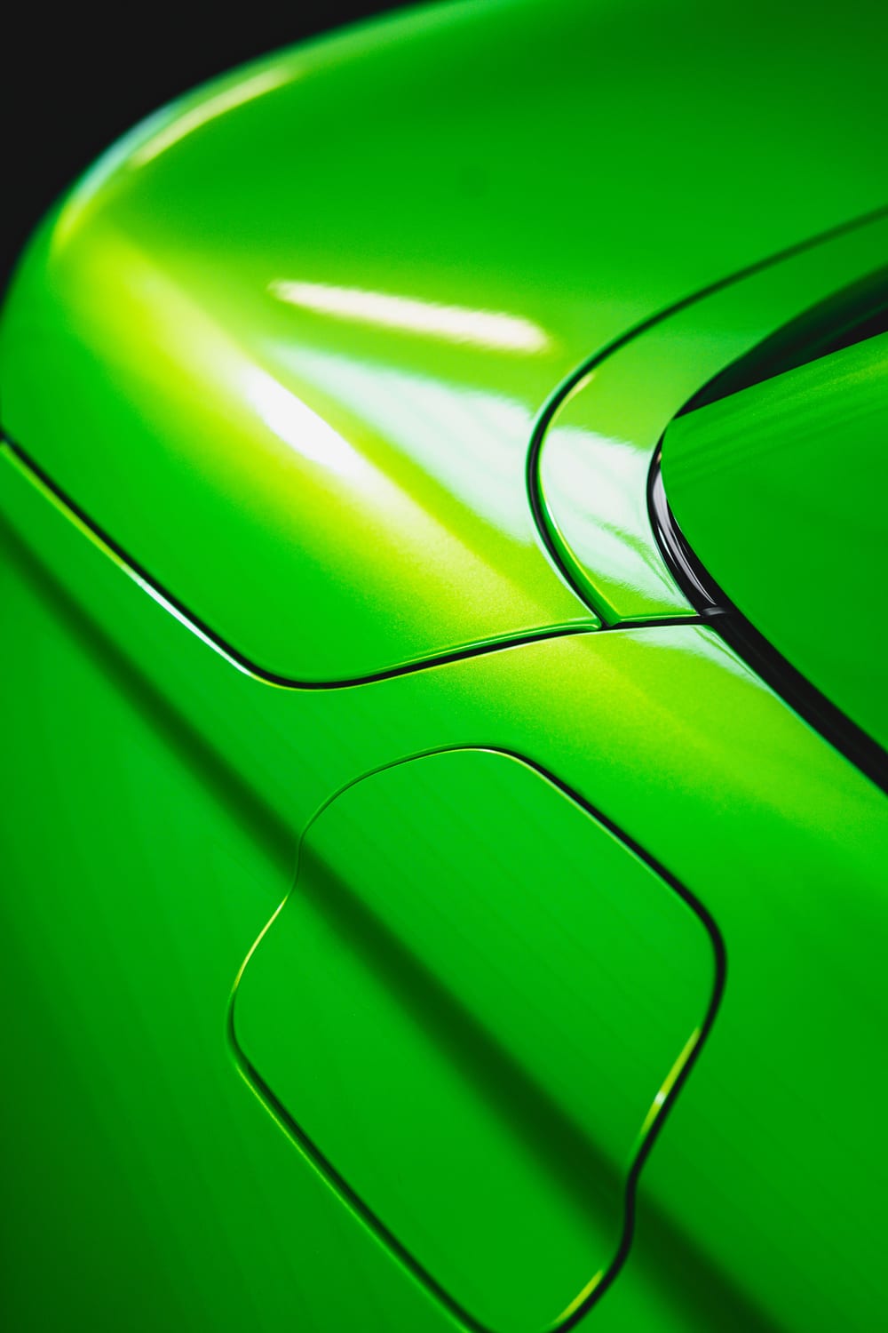 Close-up of a ceramic-coated panel, light reflecting cleanly across the paint